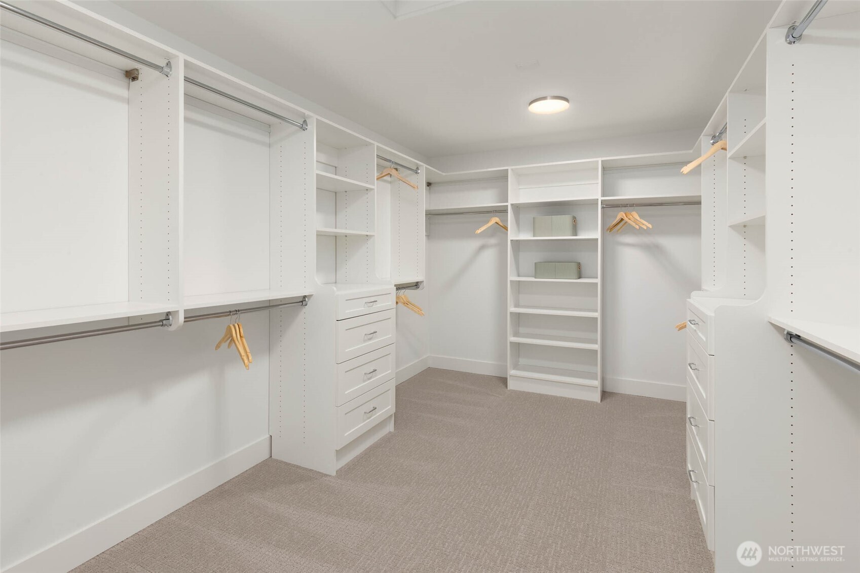 21021 Southeast 80th Street Issaquah, WA 98027 - Photo 31 of 38 a view of walk in closet with empty racks