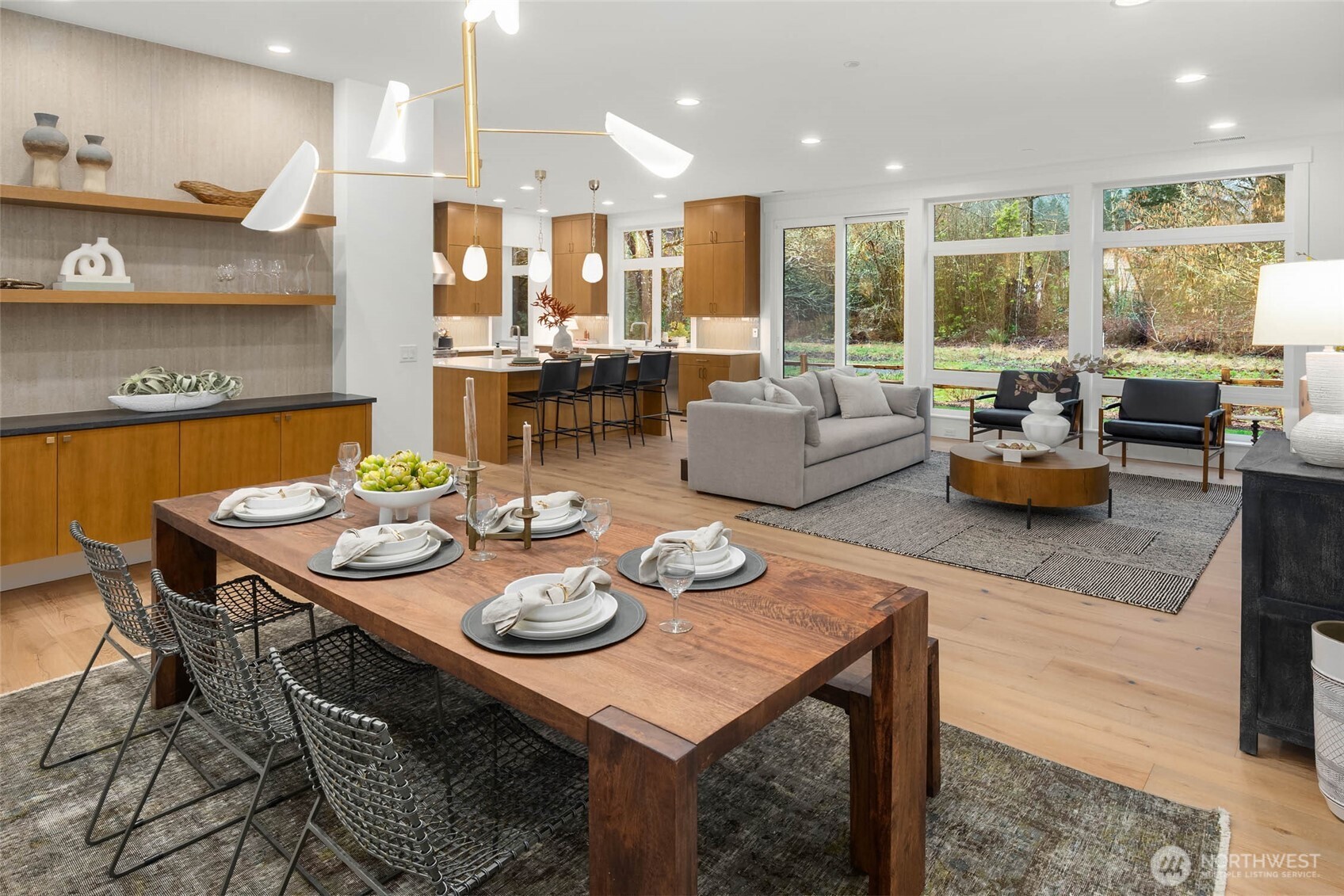 21021 Southeast 80th Street Issaquah, WA 98027 - Photo 8 of 38 a living room with stainless steel appliances a table and chairs