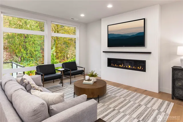 a living room with furniture and a large window