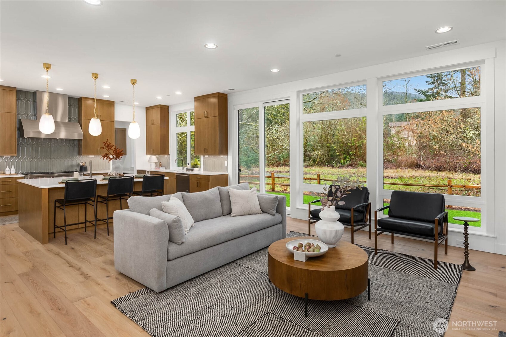 21021 Southeast 80th Street Issaquah, WA 98027 - Photo 9 of 38 a living room with furniture and a large window