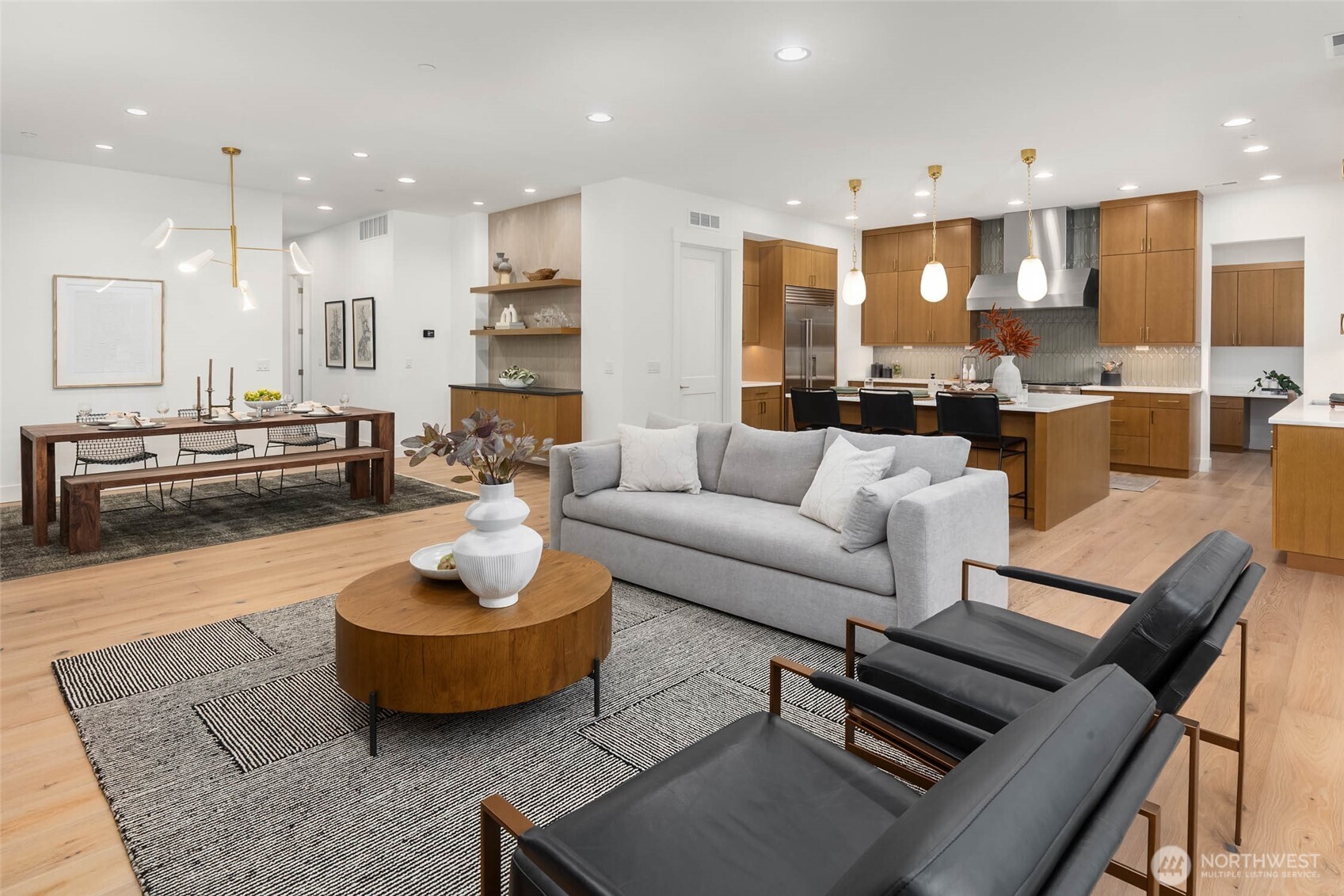 21021 Southeast 80th Street Issaquah, WA 98027 - Photo 10 of 38 a living room with furniture kitchen and a table