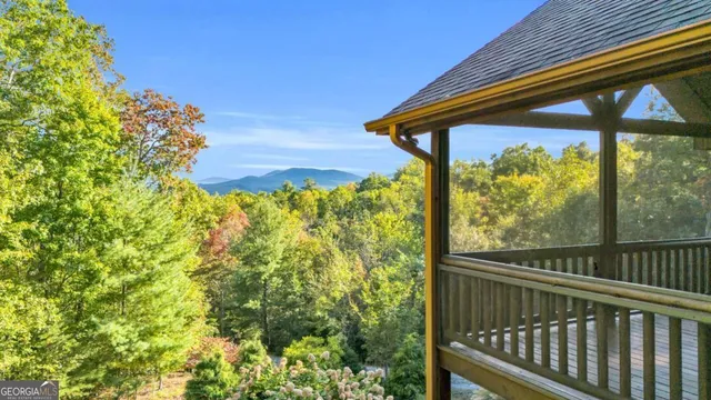 a front view of a house with yard and garage