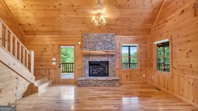 a kitchen with granite countertop a sink stainless steel appliances and cabinets