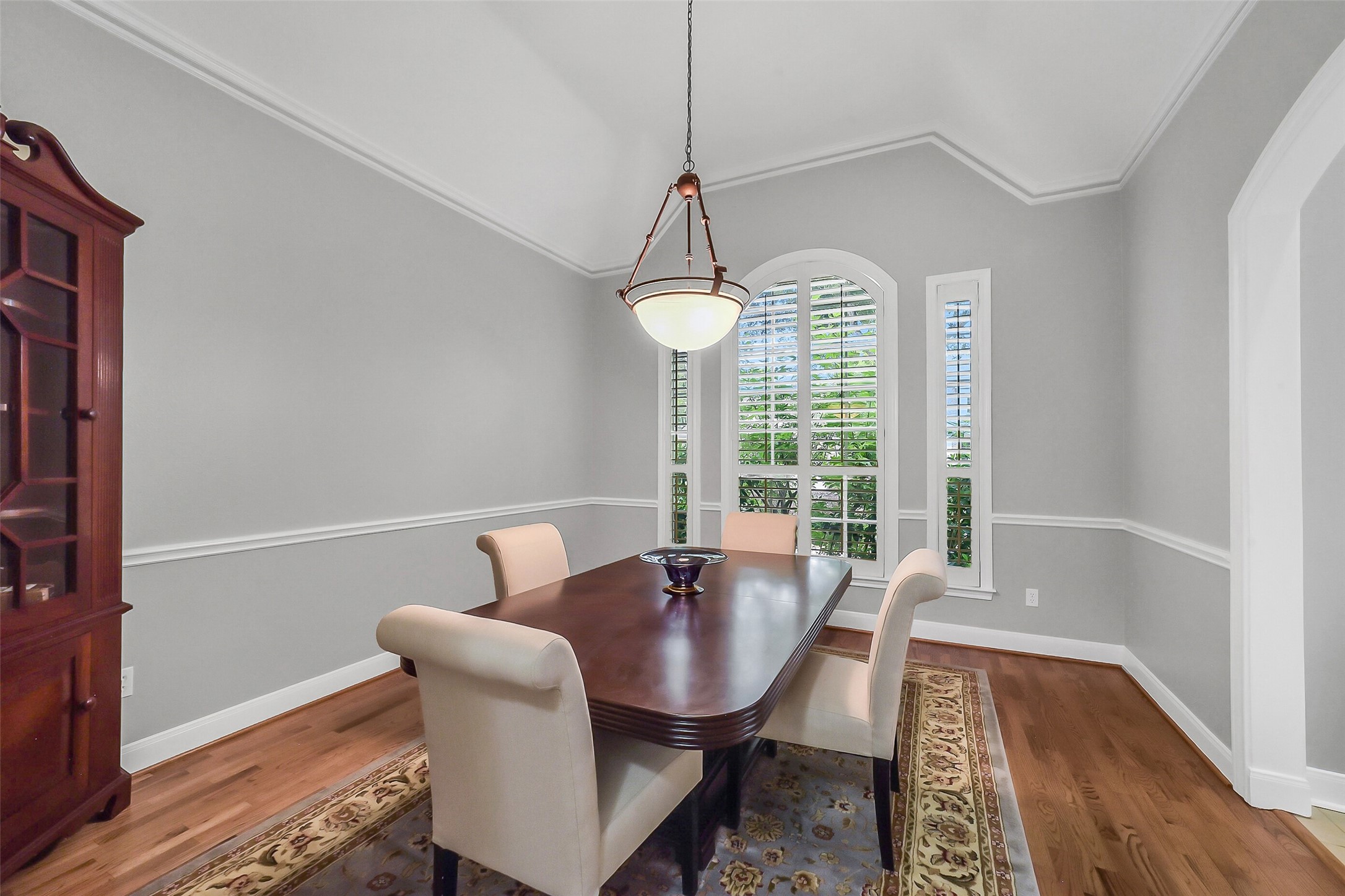1260 Fries Road Houston, TX 77055 - Photo 14 of 42 Formal Dining Room Draped in Crown Molding and Arched Windows, Perfect for any Gathering!