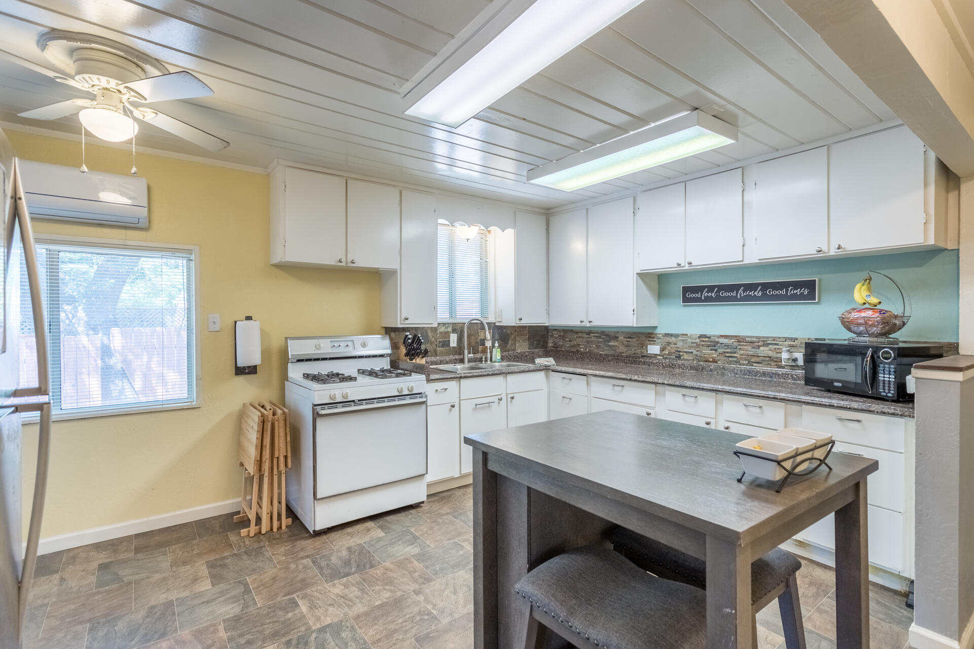 1116 Layton Road Redding, CA 96002 - Photo 1 of 11 a kitchen with a stove a sink and cabinets