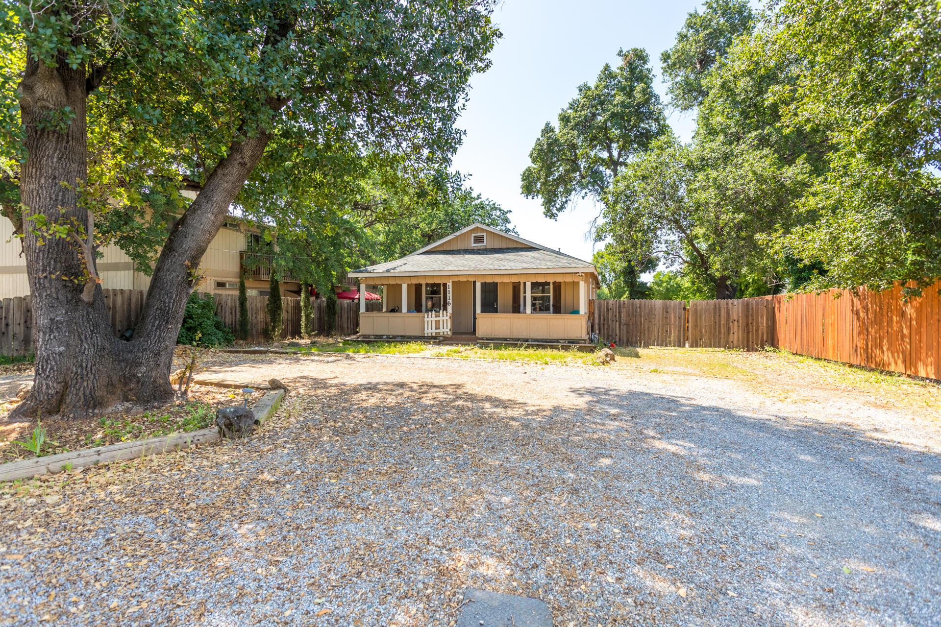 1116 Layton Road Redding, CA 96002 - Photo 2 of 11 a swimming pool with wooden fence