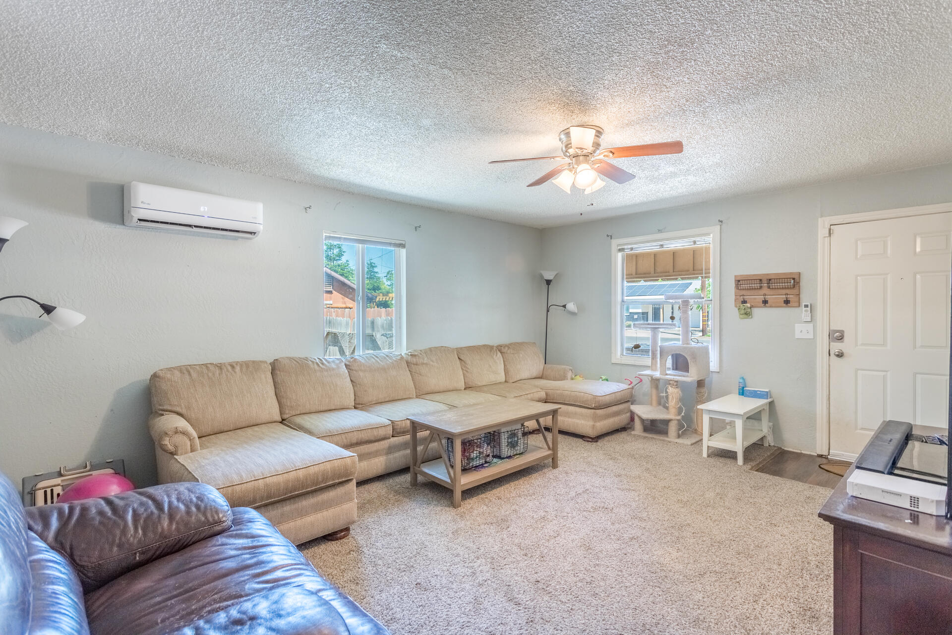 1116 Layton Road Redding, CA 96002 - Photo 3 of 11 a living room with furniture and a ceiling fan