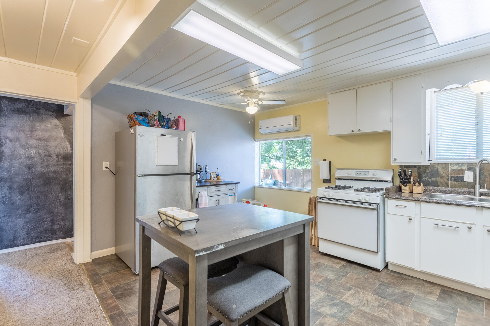 1116 Layton Road Redding, CA 96002 - Photo 4 of 11 a kitchen with refrigerator cabinets and sink