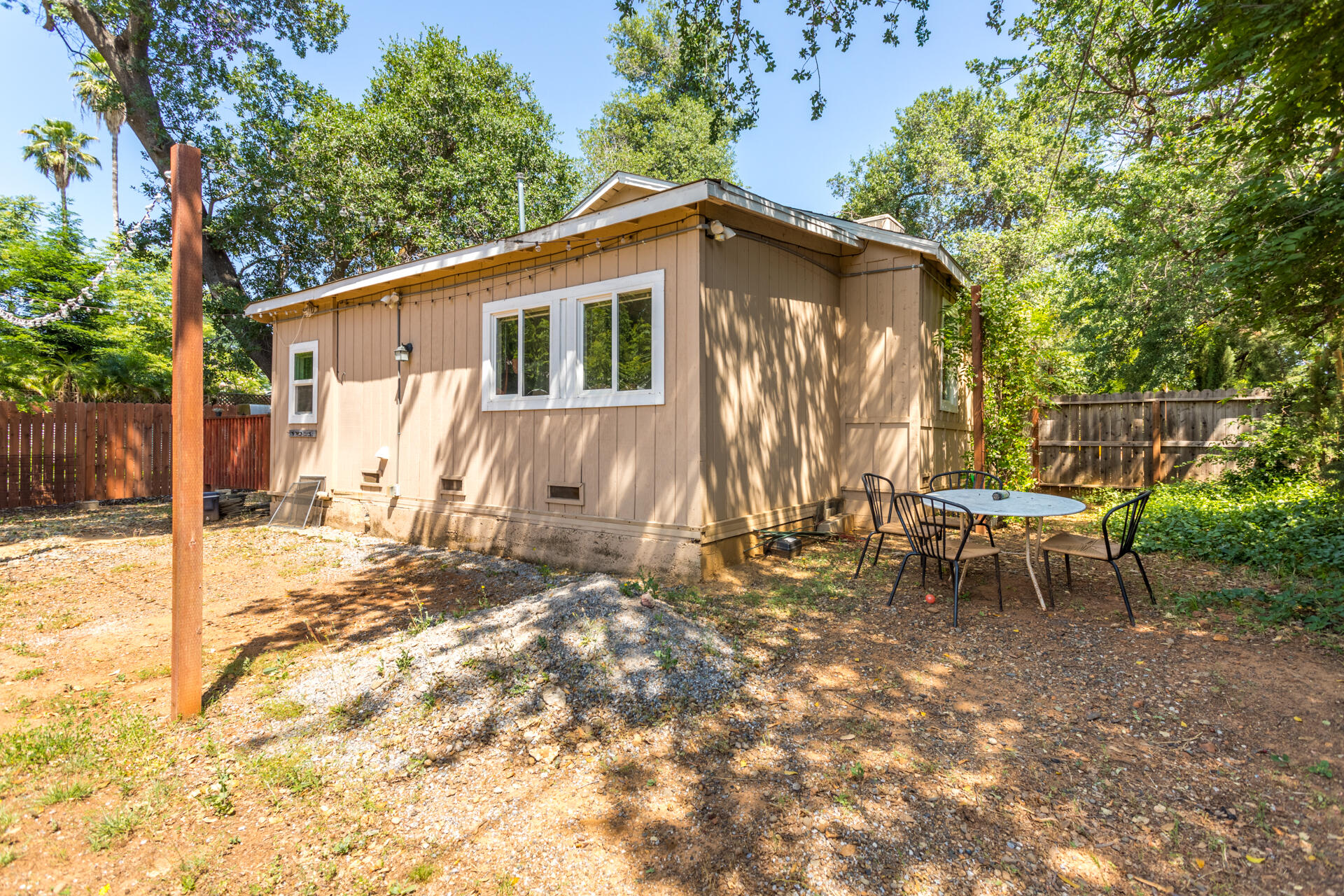 1116 Layton Road Redding, CA 96002 - Photo 10 of 11 a view of a house with backyard and sitting area