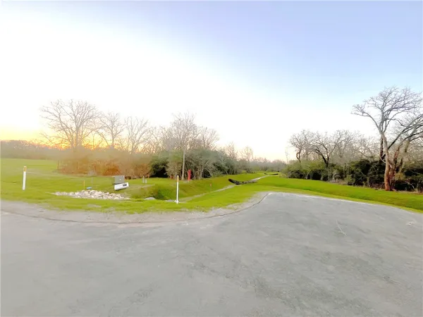 a view of a lake with a big yard