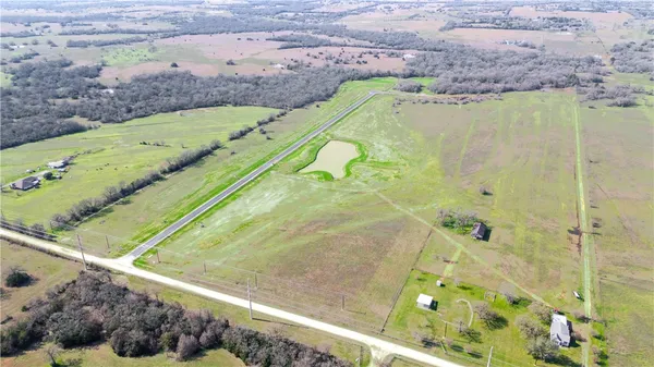 a view of a swimming pool with a yard
