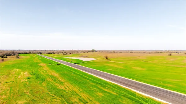 a view of a lake with a big yard