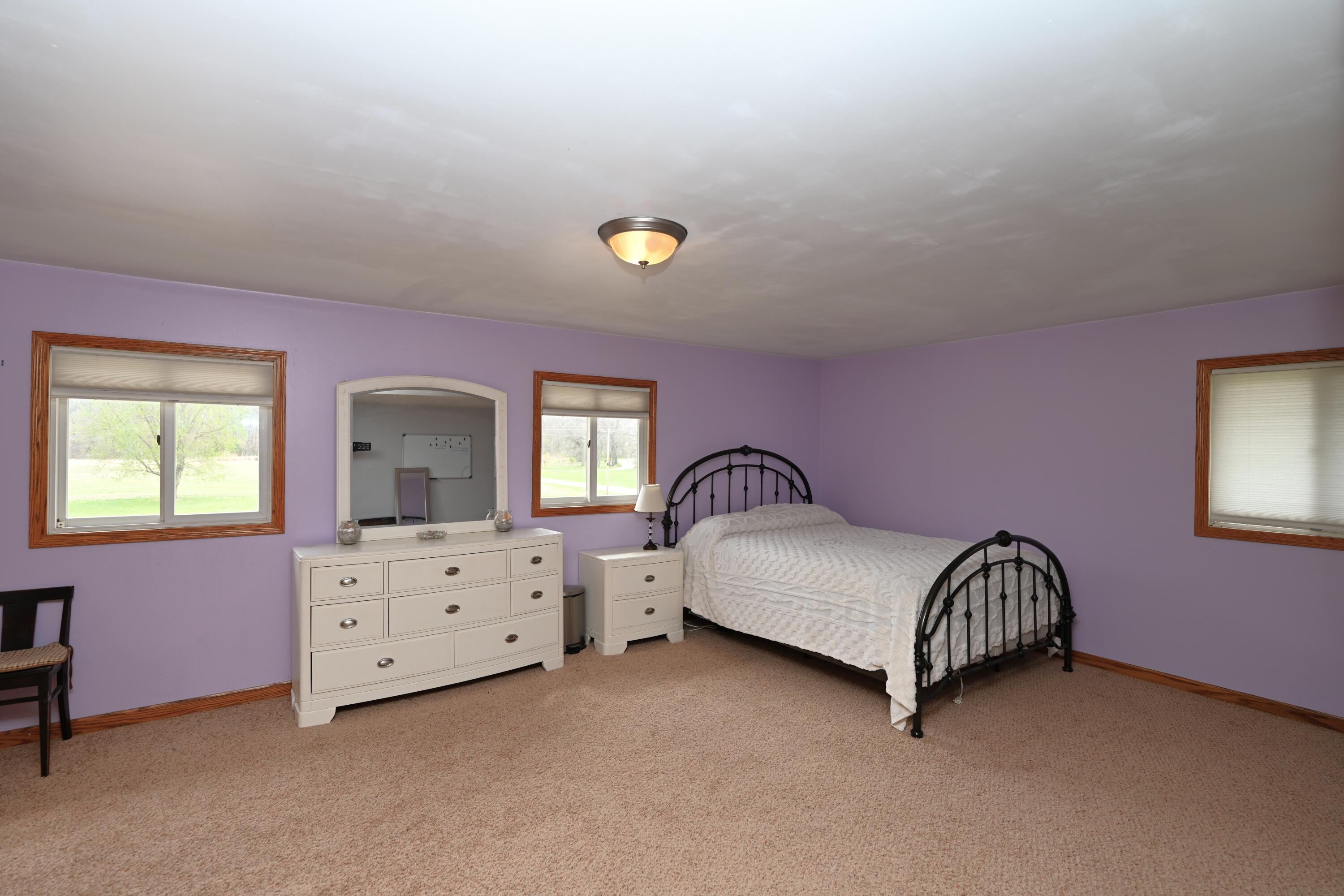 5110 West 400 North Winamac, IN 46996 - Photo 25 of 35 a spacious bedroom with a bed and a window