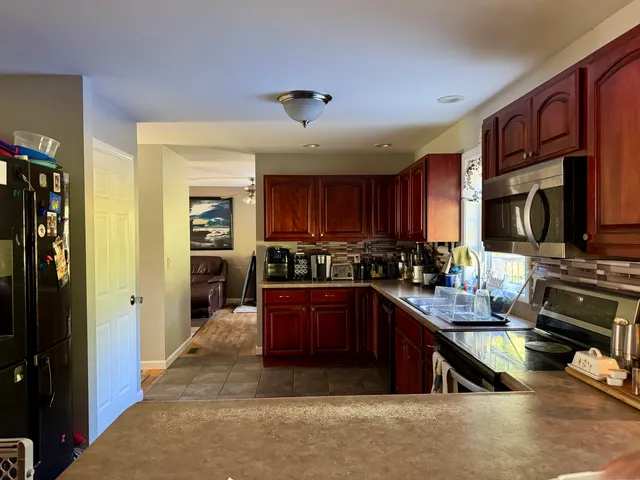 a kitchen with lots of counter top space and appliances