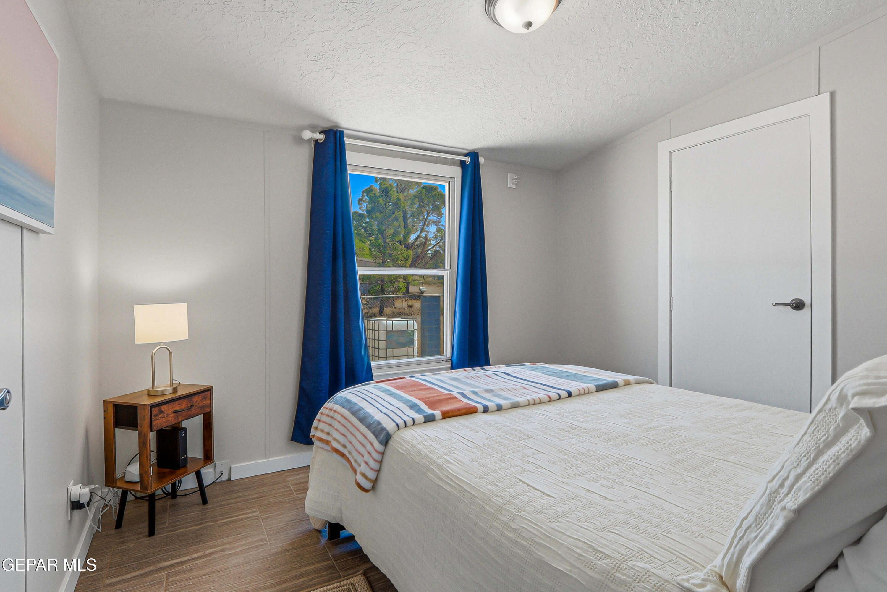 2901 Cook Street Truth or Consequences, NM 87901 - Photo 25 of 31 a bedroom with a bed and a table in it with window