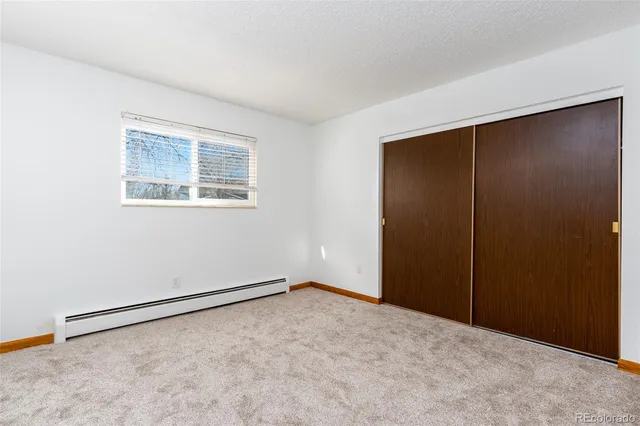 an empty room with a empty space and window