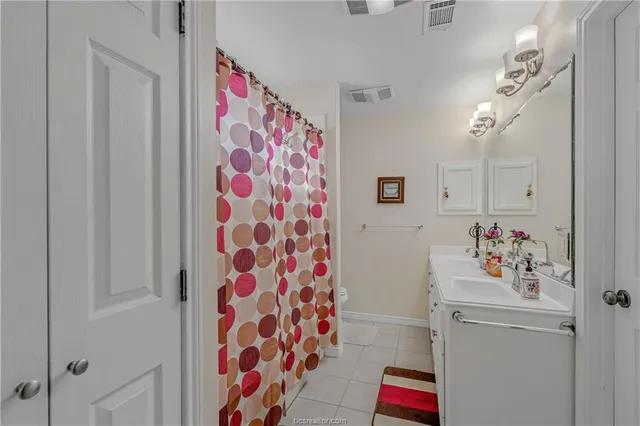 a room that has a plant and a shower curtain