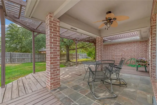 a view of a patio with a backyard