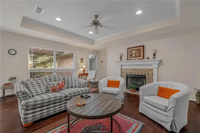 a living room with furniture and a fireplace