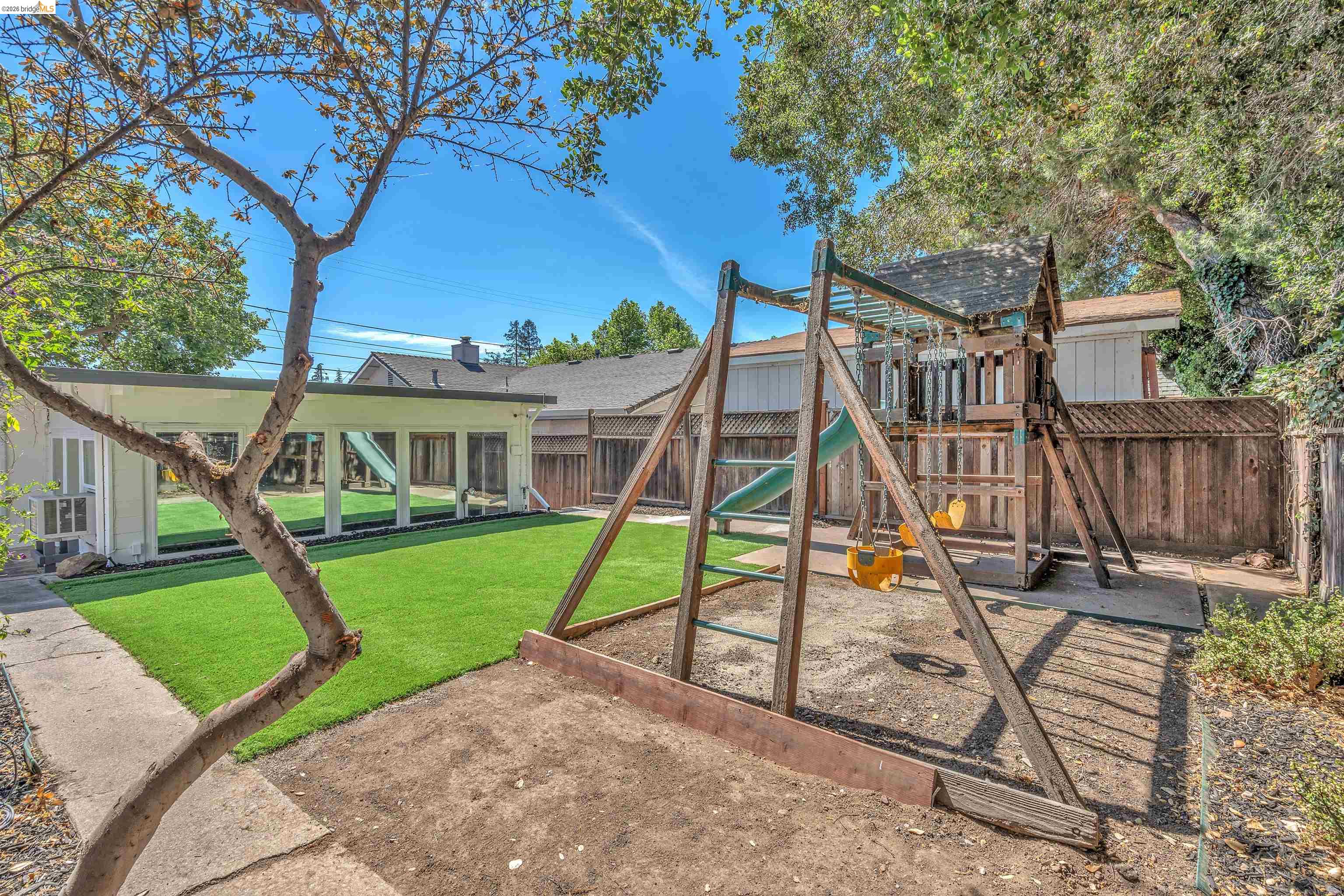 4352 Gem Avenue Castro Valley, CA 94546 - Photo 25 of 31 a view of a house with backyard and a slide