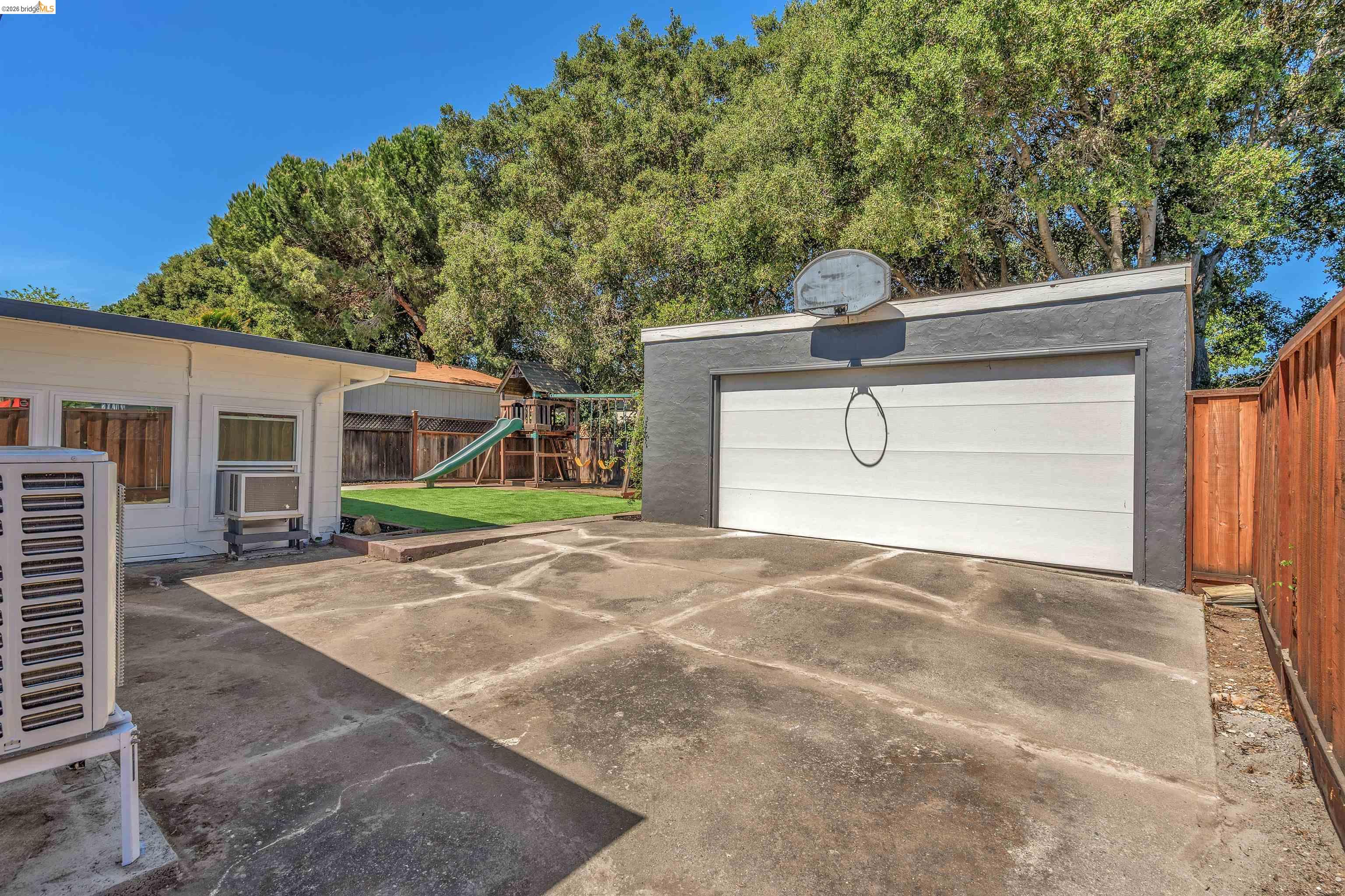 4352 Gem Avenue Castro Valley, CA 94546 - Photo 27 of 31 a front view of a house with a yard and garage