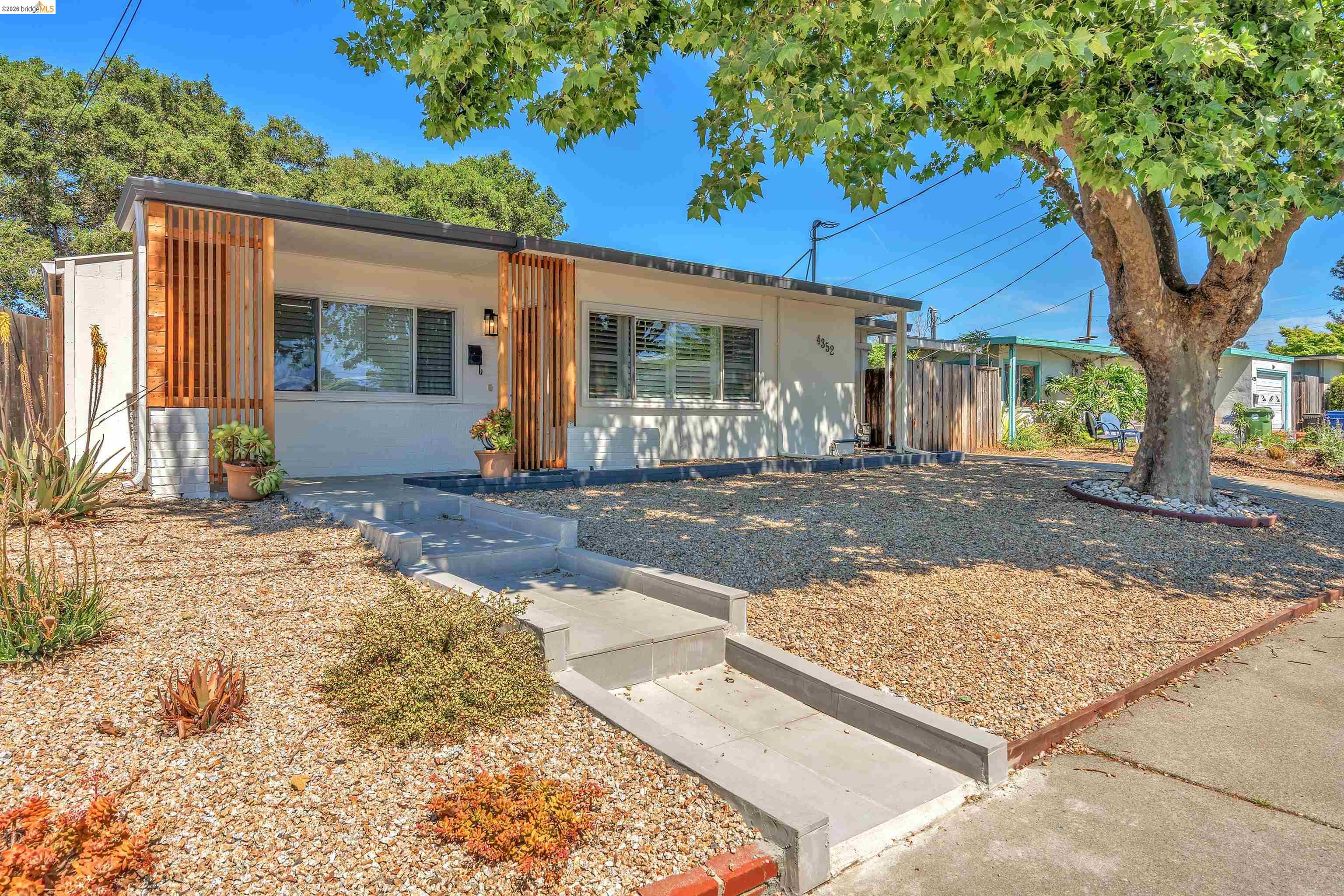 4352 Gem Avenue Castro Valley, CA 94546 - Photo 3 of 31 a front view of a house with a tree in a yard