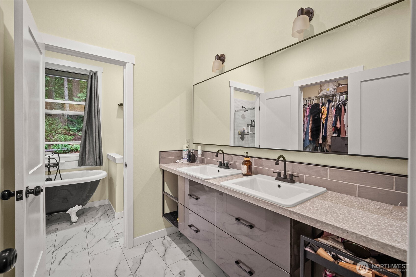 23 Spring Court Bellingham, WA 98229 - Photo 19 of 38 a bathroom with a tub sink and mirror