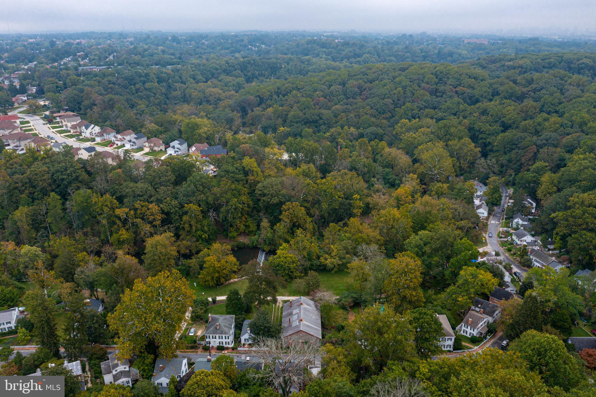 2423 Pickwick Road Baltimore, MD 21207 - Photo 5 of 34 an aerial view of a town with trees all around