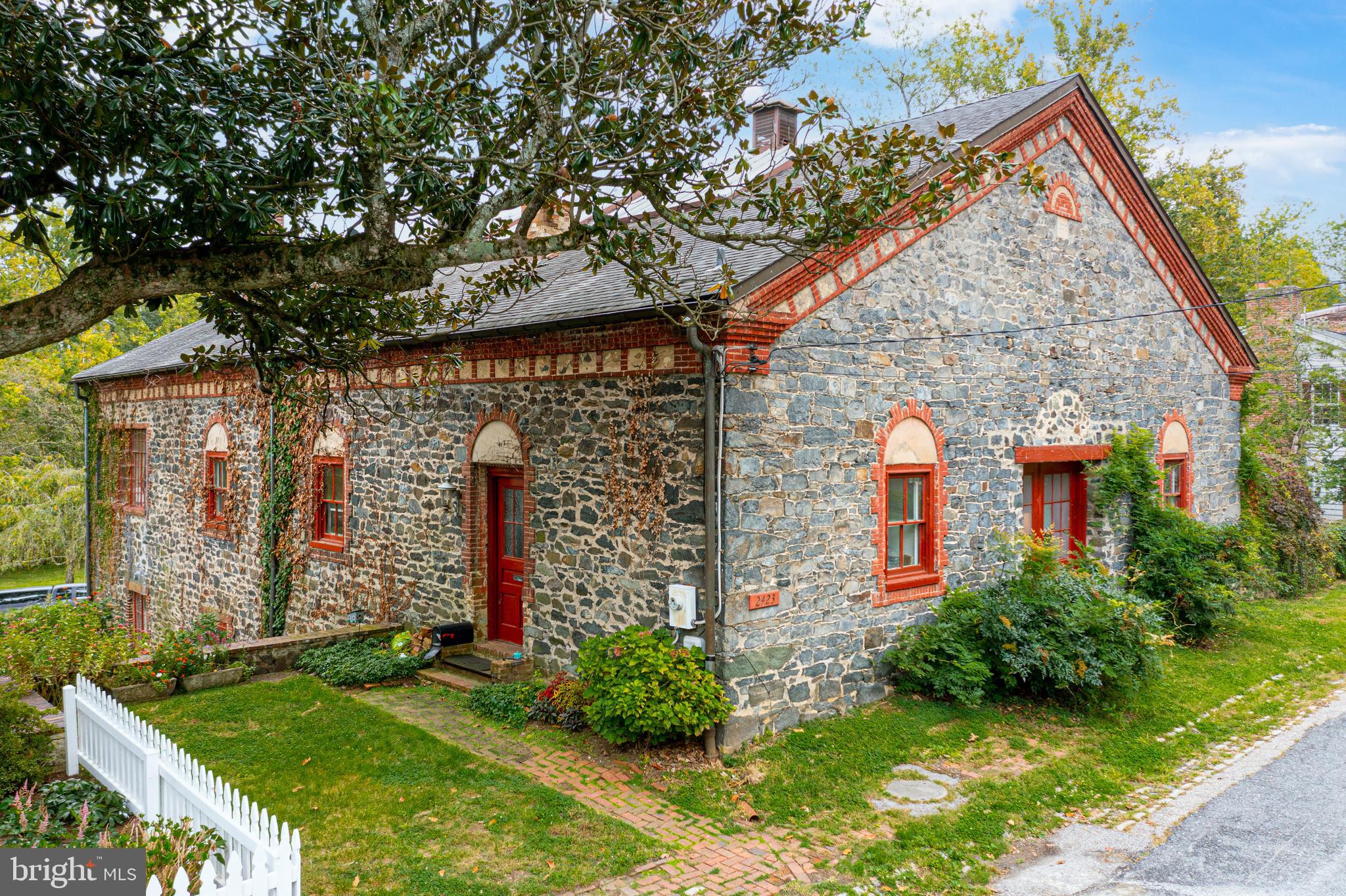 2423 Pickwick Road Baltimore, MD 21207 - Photo 7 of 34 a front view of a house with garden