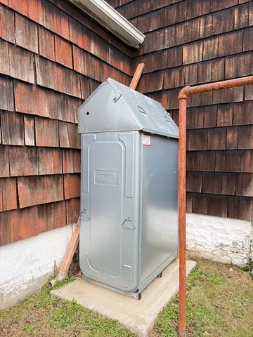 a view of a living room and wooden shelves