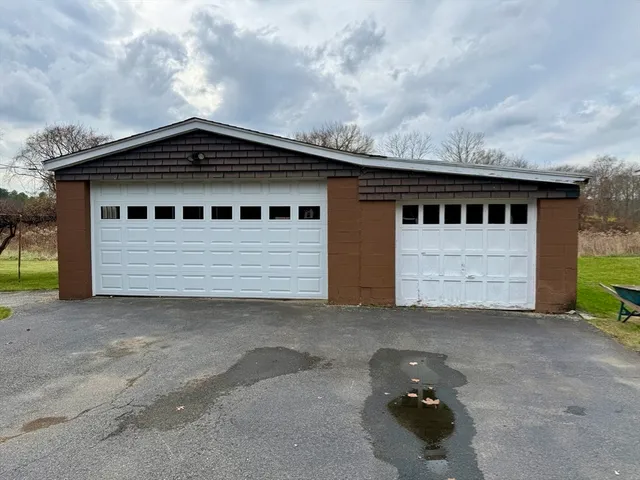 a front view of a house with a garage