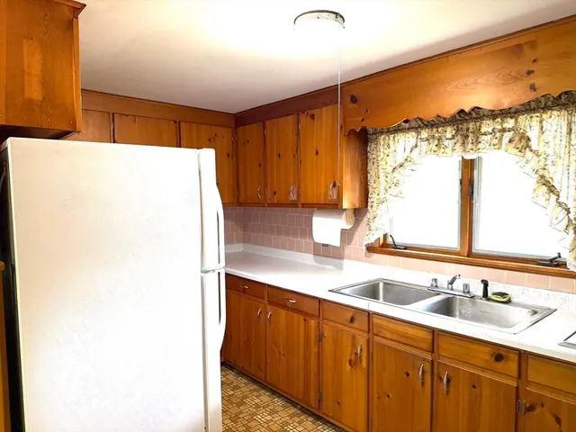 a bathroom with a sink and a large mirror