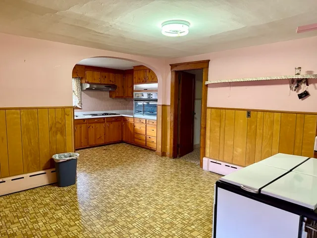 a kitchen with stainless steel appliances a sink and a refrigerator