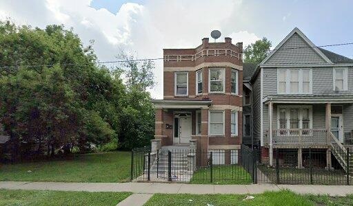 531 West 61st Place Chicago, IL 60621 - Photo 1 of 1 a front view of a house with garden