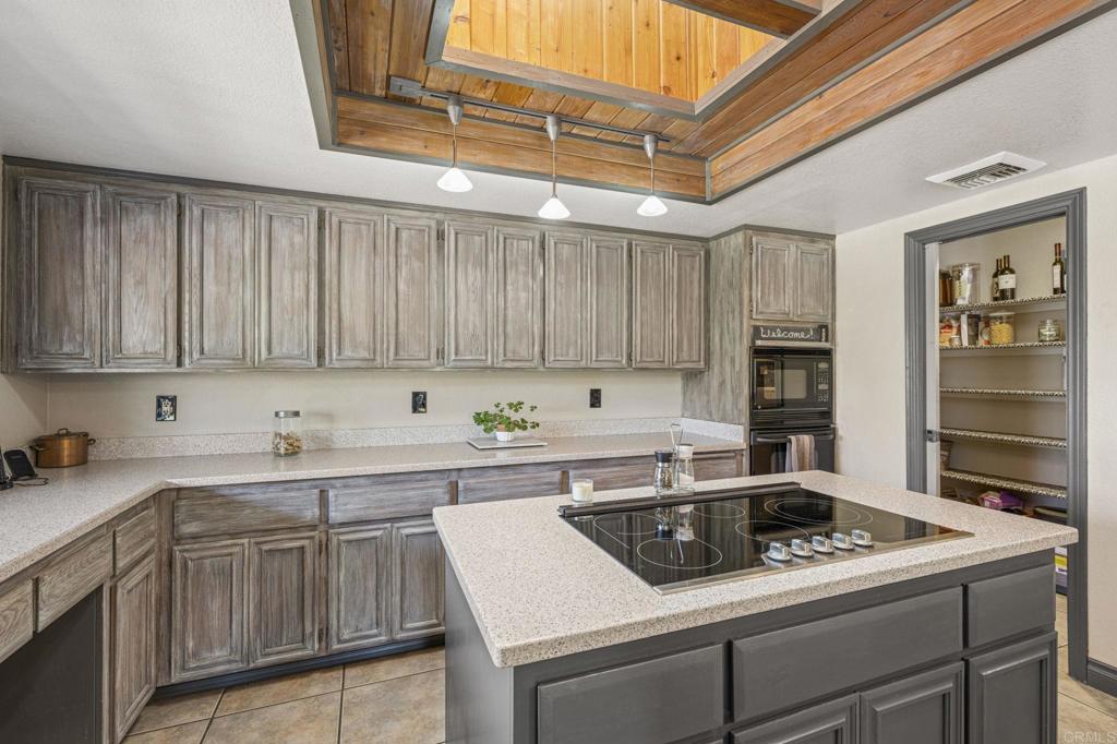 3223 Olive Hill Road Fallbrook, CA 92028 - Photo 15 of 64 a kitchen with a sink cabinets and appliances