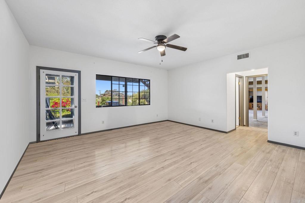 3223 Olive Hill Road Fallbrook, CA 92028 - Photo 29 of 64 a view of empty room with wooden floor and fan