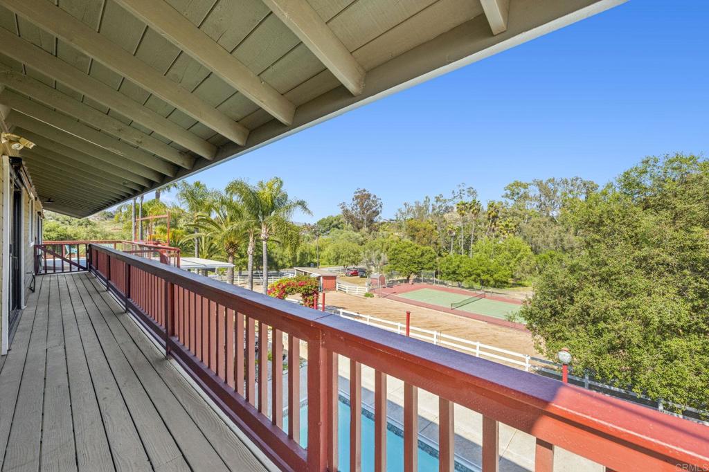 3223 Olive Hill Road Fallbrook, CA 92028 - Photo 39 of 64 a view of a balcony with wooden floor and outdoor space