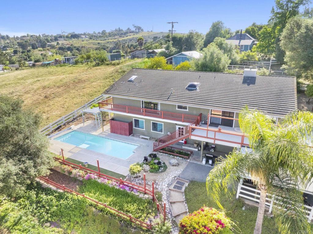 3223 Olive Hill Road Fallbrook, CA 92028 - Photo 42 of 64 an aerial view of a house with a swimming pool patio and outdoor seating