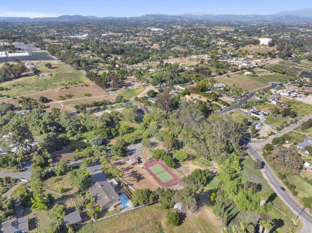 3223 Olive Hill Road Fallbrook, CA 92028 - Photo 48 of 64 an aerial view of residential house with parking and trees