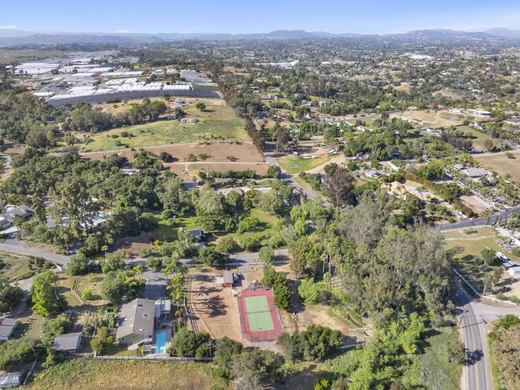 3223 Olive Hill Road Fallbrook, CA 92028 - Photo 49 of 64 an aerial view of residential houses with outdoor space and trees