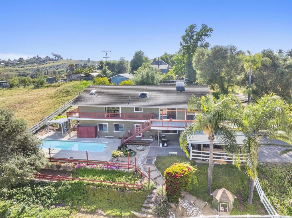 3223 Olive Hill Road Fallbrook, CA 92028 - Photo 53 of 64 an aerial view of a house with a garden and lake view