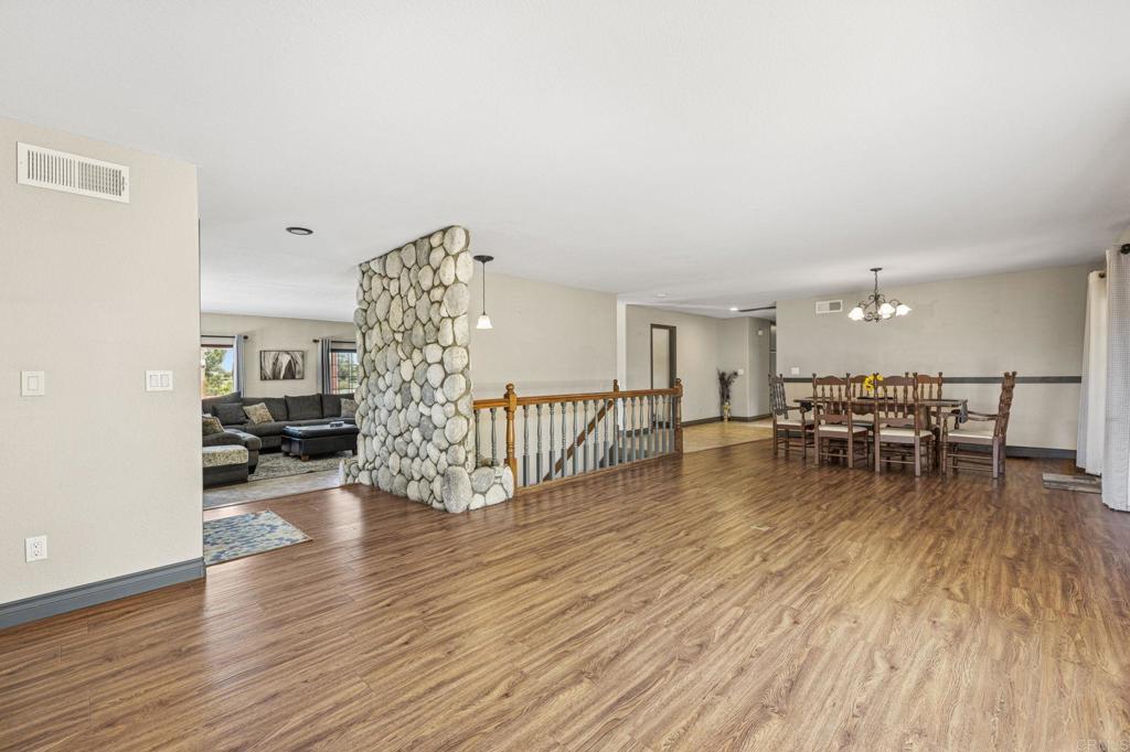 3223 Olive Hill Road Fallbrook, CA 92028 - Photo 58 of 64 a living room with furniture and a wooden floor