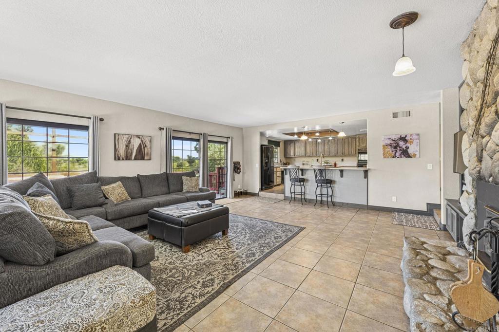 3223 Olive Hill Road Fallbrook, CA 92028 - Photo 8 of 64 a living room with furniture and a table