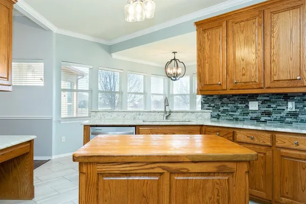 a bathroom with a sink and a large mirror