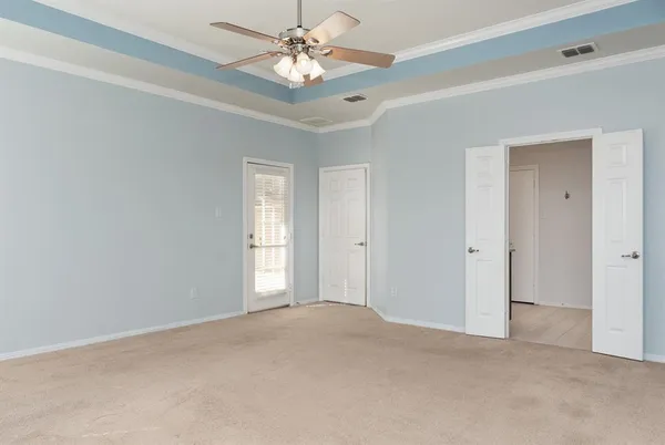 a view of an empty room with a window