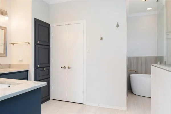 a bathroom with a bathtub and a sink