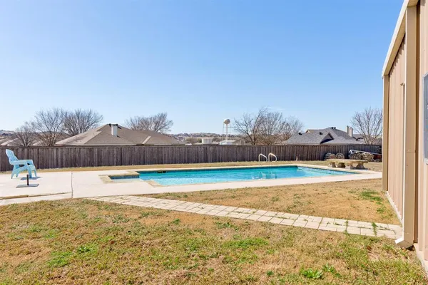 a view of a swimming pool and an outdoor space