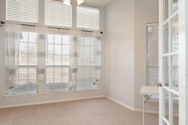 a view of an empty room with a window