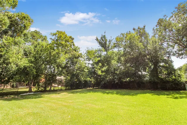 a view of a swimming pool and an outdoor space