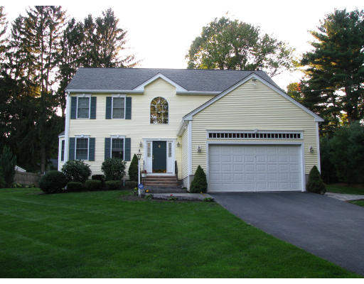 a view of house with yard and green space